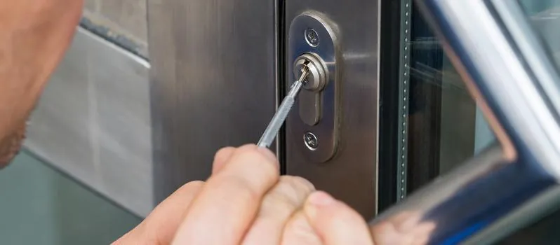 Locksmith opening a locked commercial door during a 24-hour emergency call